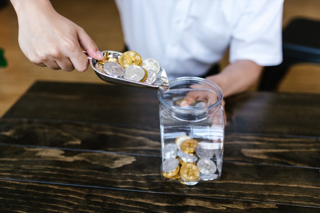 Pouring coins into a container